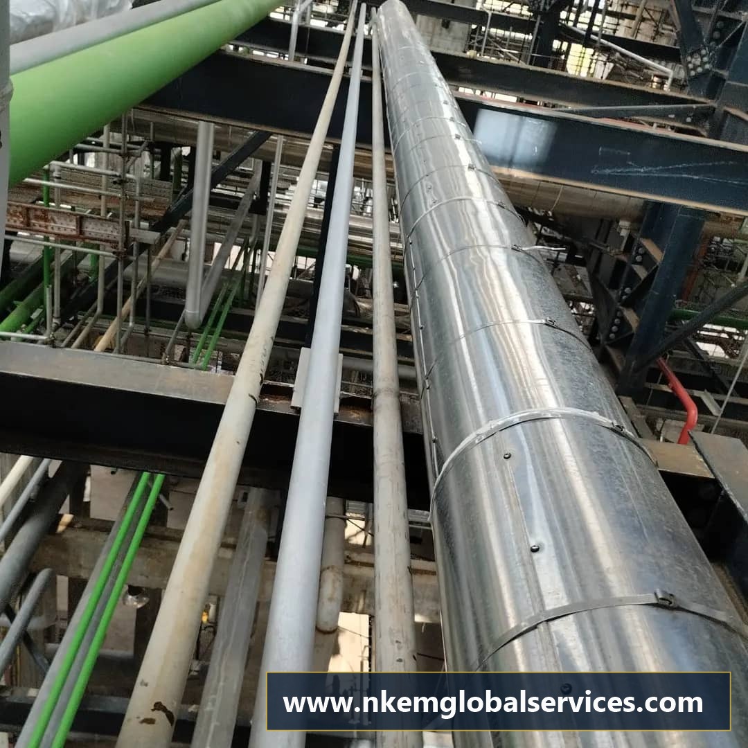 Completed aluminum clad process pipeline on structural steel pipe rack