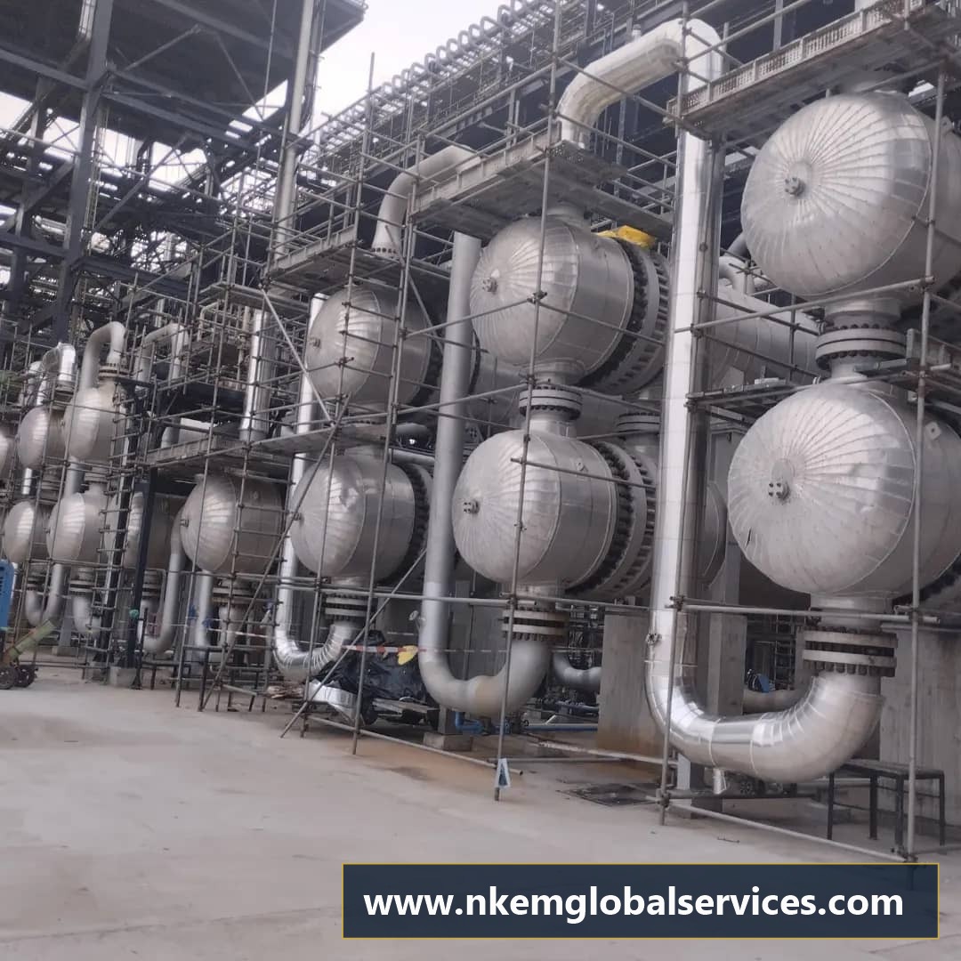 Shell and tube heat exchanger battery with domed cladding and turnaround scaffolding